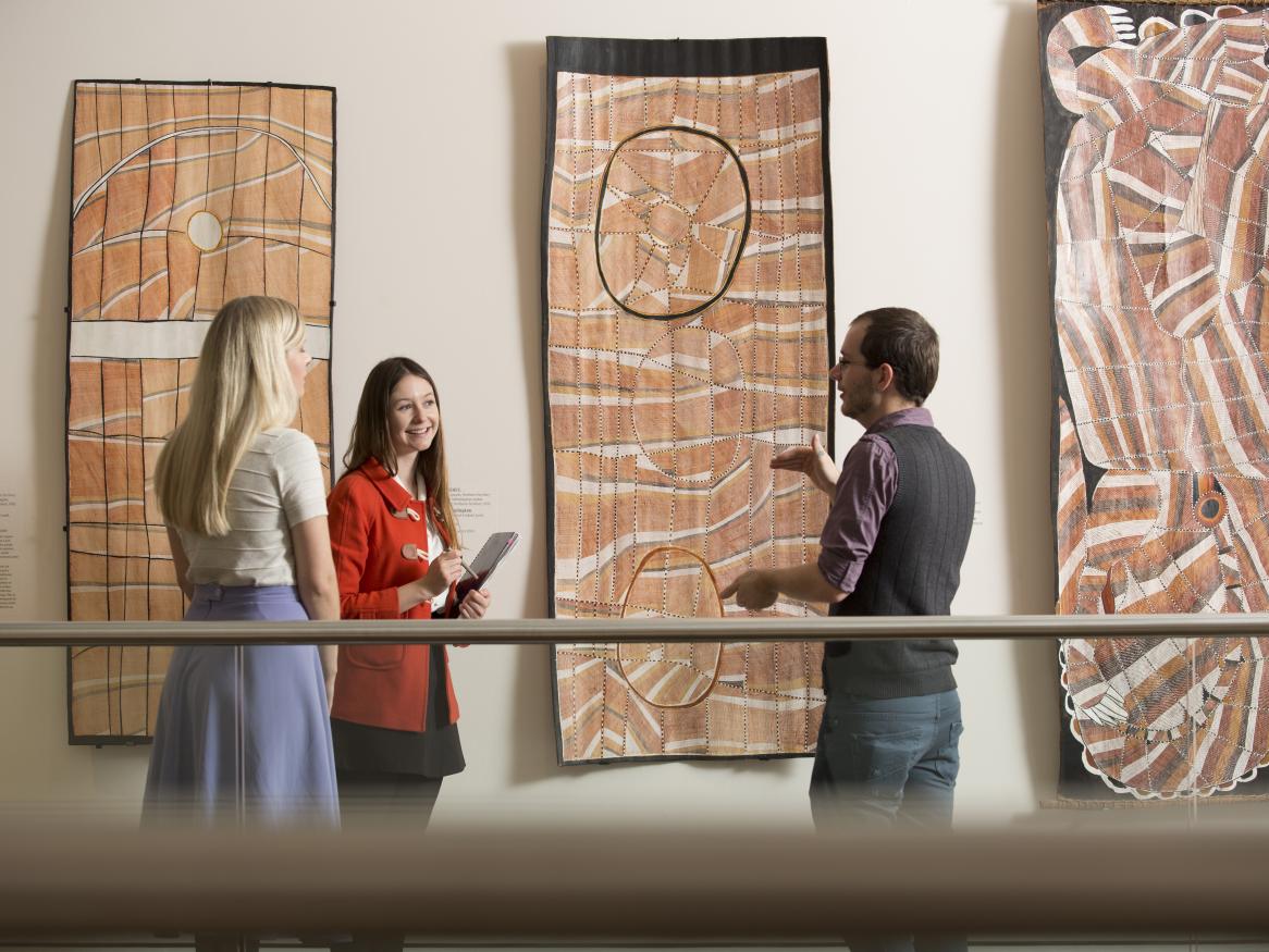 People talking in a museum