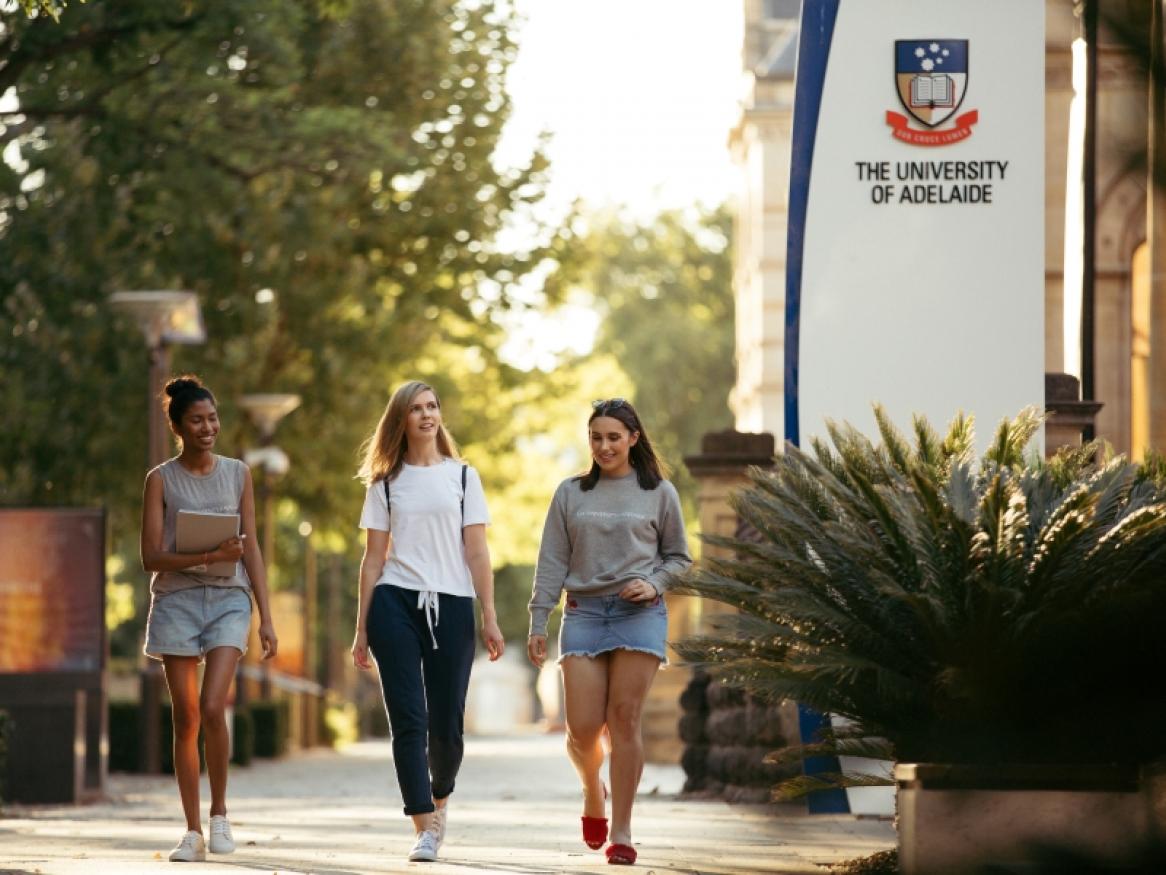 students in campus. UoA logo as backgorund.