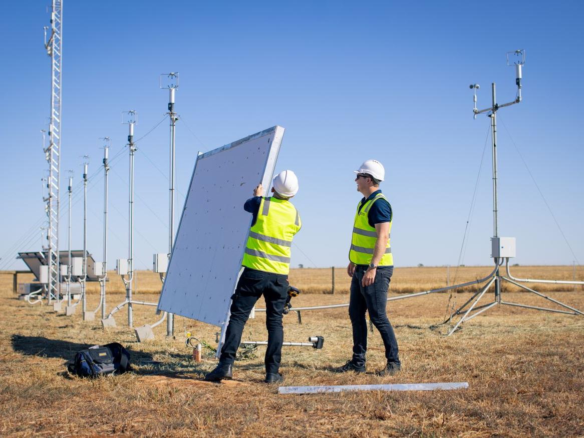 Engineers installing wind panels