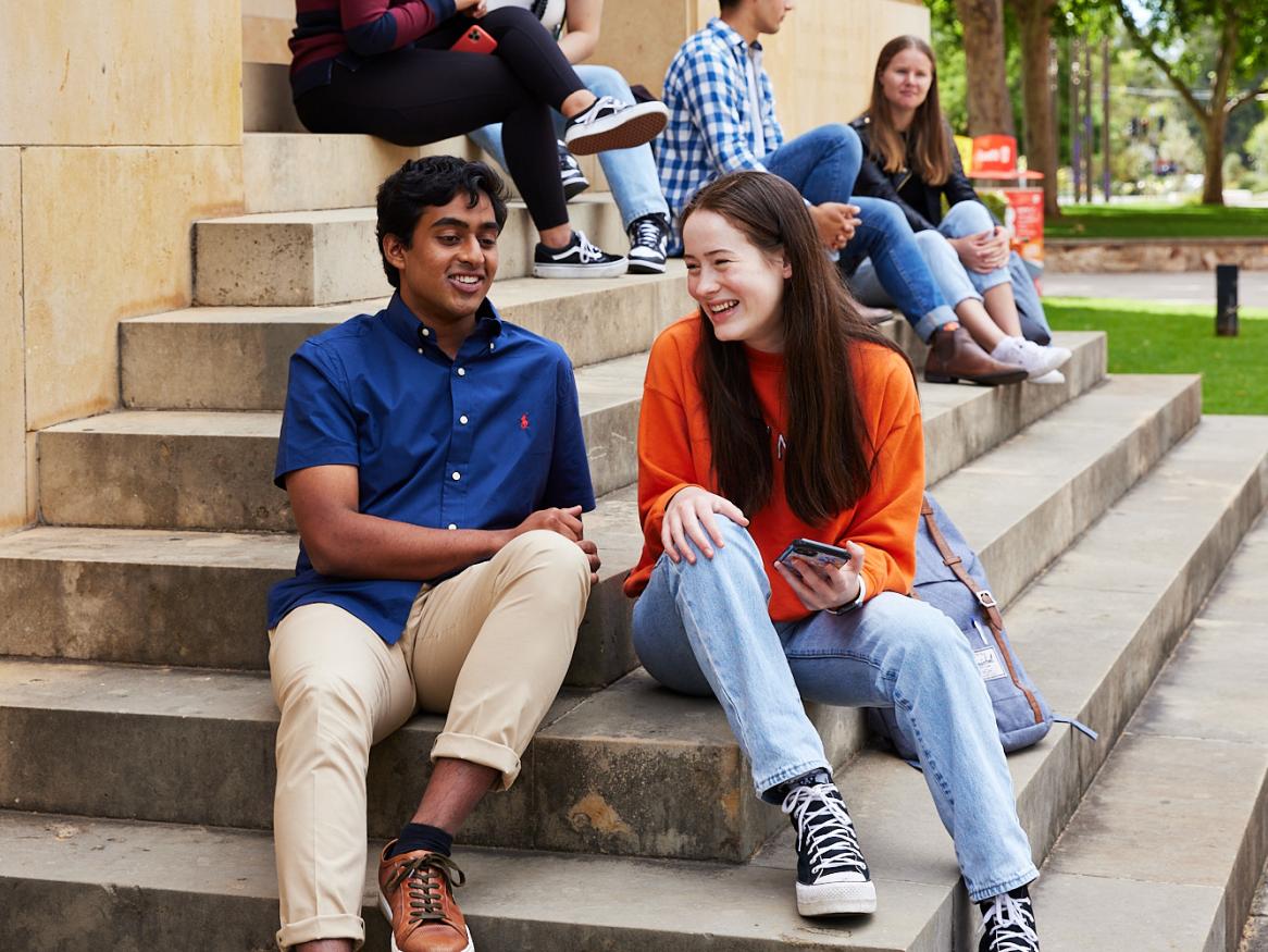 Students sitting on stairs to Barr Smith Library