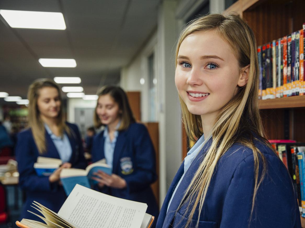 Photo of school student in the library