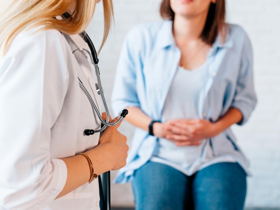 Woman receiving advice from health care professional