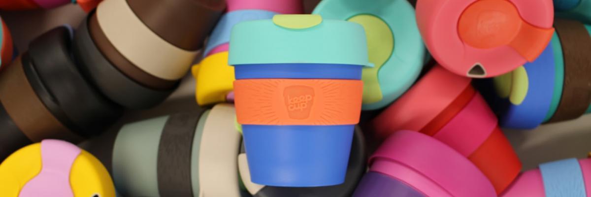 Pile of colourful reusable keep cups