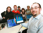 Computer Science lecturer Dr Nick Falkner and students with one of the iPads
Photo by Andrea Laube, courtesy of <i>The Advertiser</i>