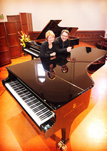 Associate Professor Carl Crossin, Director of the Elder Conservatorium of Music, and Lucinda Collins, Head of Keyboard, with the two brand new Steinway pianos
Photo by Mark Brake, courtesy of <i>The Advertiser</i>