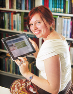 Science student Erinn Fagan-Jeffries with an Apple iPad.  These devices are about to play an important role in the way Science is taught from 2011.
Photo by Calum Robertson, courtesy of <i>The Advertiser</i>