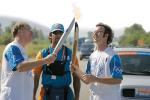 Dr Richard Kelso (left) and Dr Jordan Parham (right) in Drama, Greece, passing the flame during the torch relay
Photo: Organising Committee for the Olympic Games