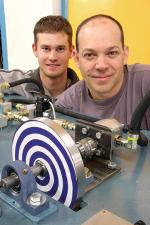 Mechanical Engineering students Daniel Post (left) and Philip MacDonald with their entry for this years project exhibition: a car brake energy regeneration system.  The system is a compact method of storing the braking energy of a car and reusing it to assist with acceleration.
Photo by Ben Osborne