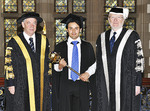 Mace bearer and Theoretical Physics MPhil graduate Manuel Carrillo Serrano (centre) with Chancellor the Hon. Robert Hill and Vice-Chancellor and President Professor James McWha