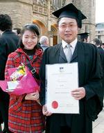 Li Bo graduated with a Bachelor of Economics, pictured with friend Jing Shi