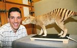 Dr Jeremy Austin with a mounted specimen of a baby thylacine from the SA Museum
Photo by Candy Gibson