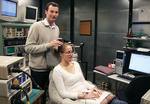 Martin Sale demonstrates how a magnetic coil is used to stimulate nerve activity in the brain
Photo by David Ellis