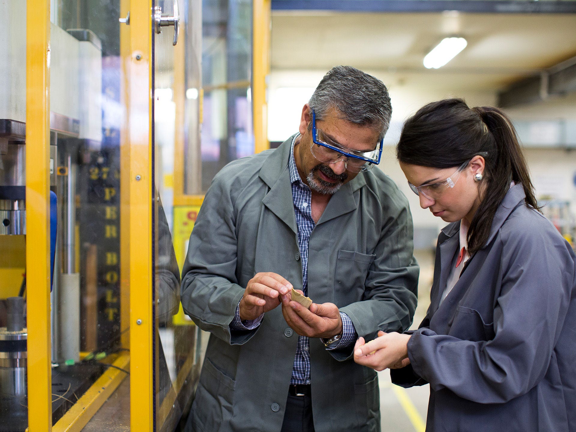 Staff and students in an engineering lab