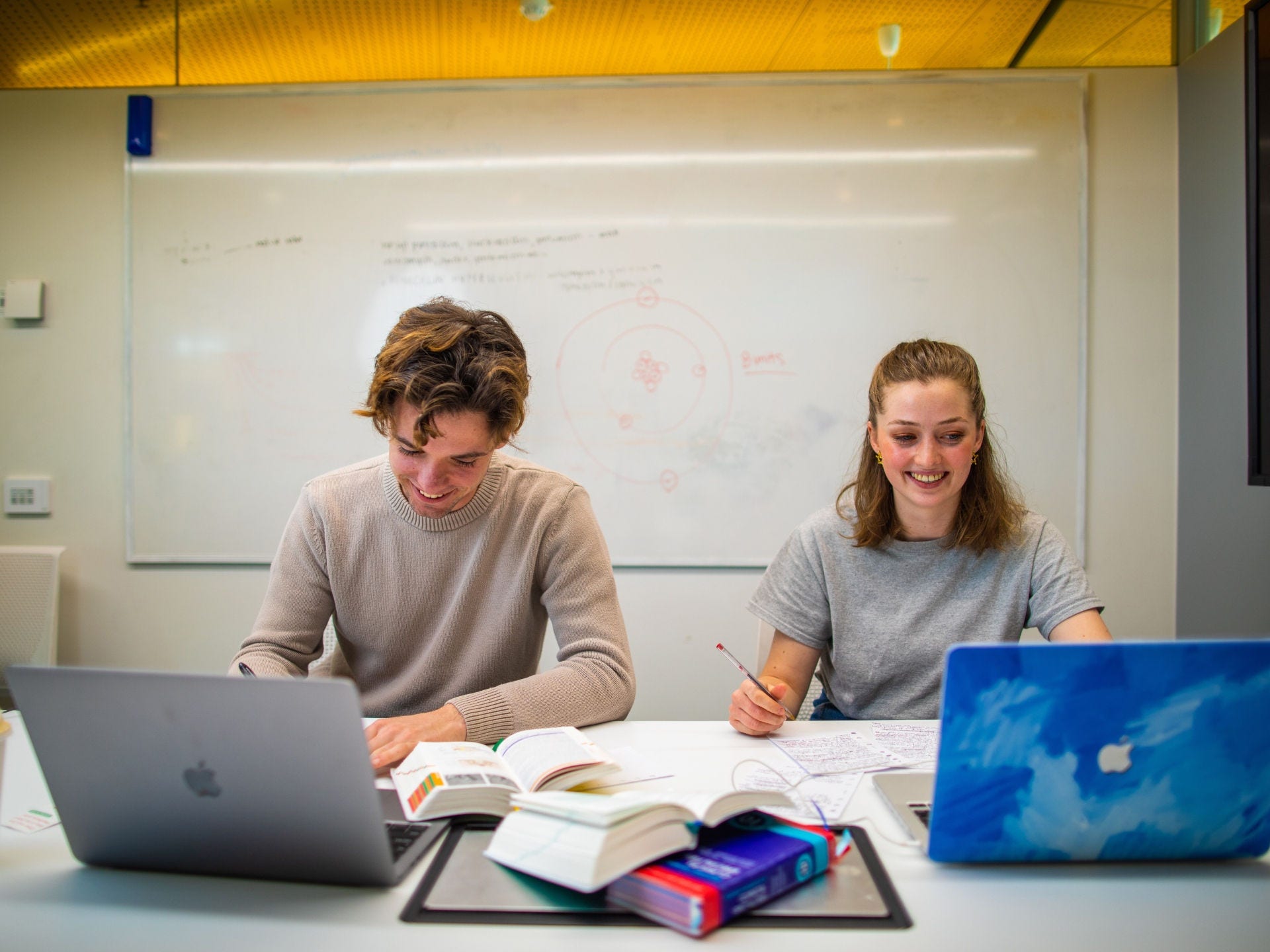 Undergraduate students studying with laptops in a quiet study room in the AHMS building.

Talent:
Sean Stobie - male, grey jumper
Lena Eversheim - female, grey shirt