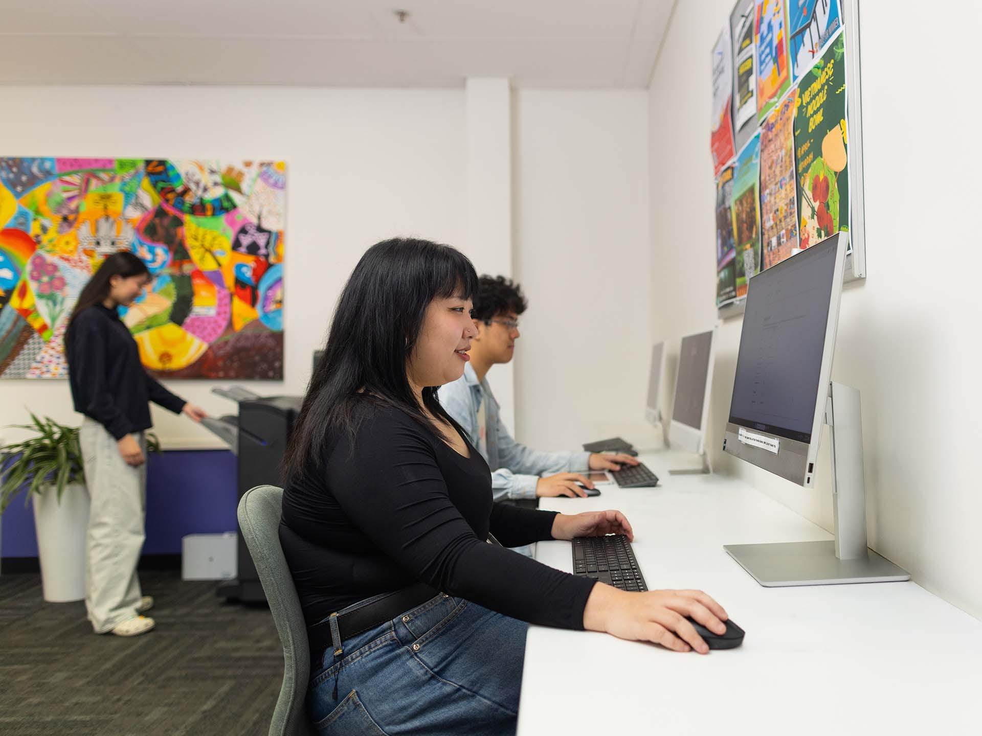 Residents using the study facilities at Adelaide University Village student accommodation