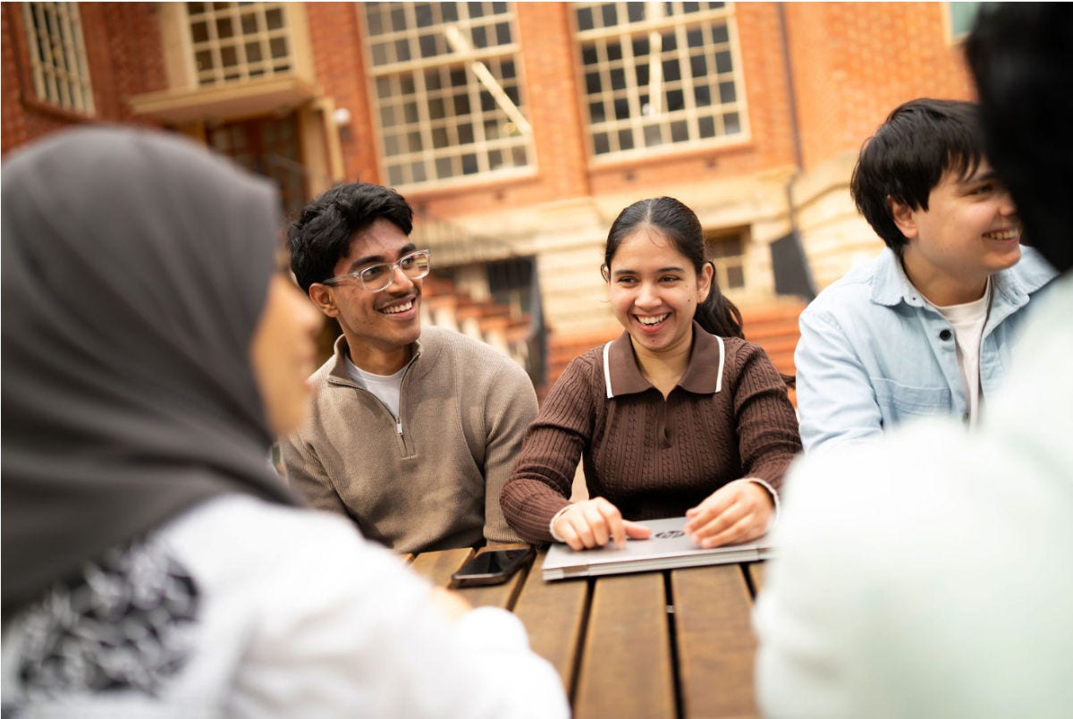 AU students sat on a bench 