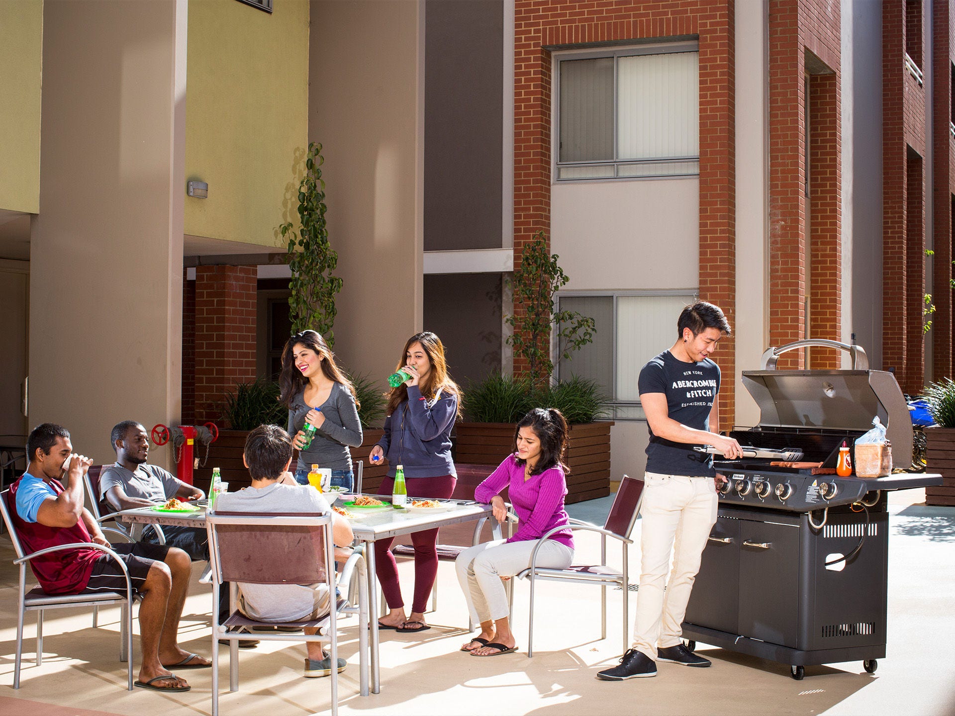Residents socialising at Adelaide University Village student accommodation