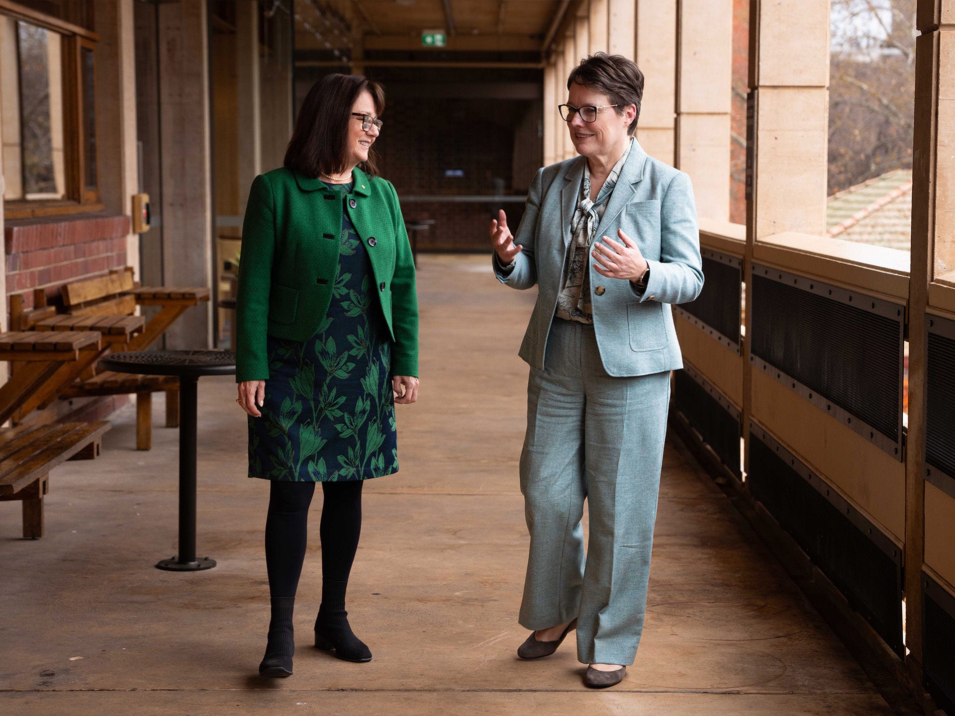 Episode 2, Immunity and impact: Vaccines, trust, and global health: Vice Chancellor and President Nicola Phillips and Professor Helen Marshall walking on campus.