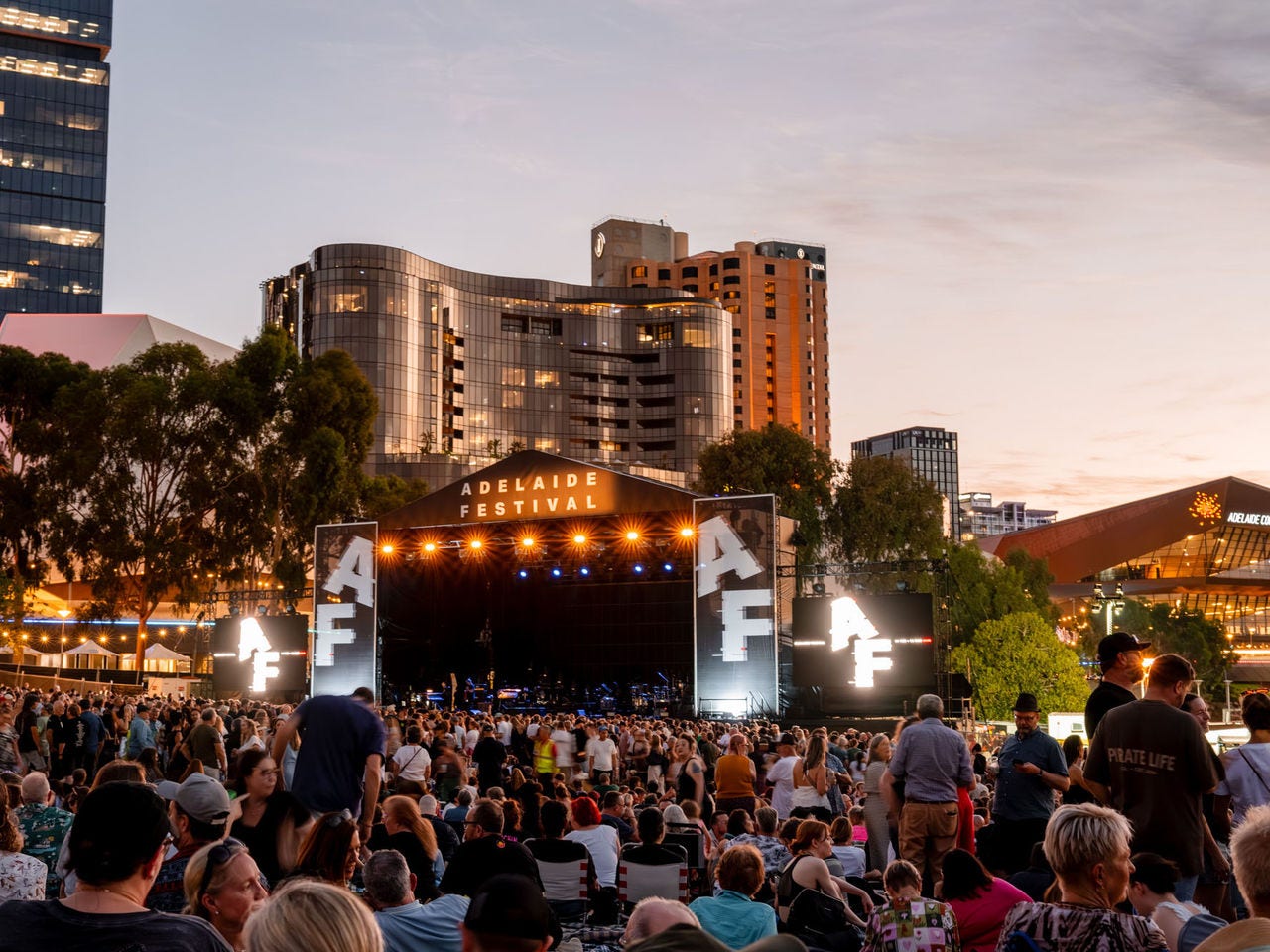The Adelaide Festival main stage at dusk with a crowd of spectators