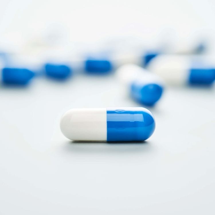 stock image of blue and white capsule