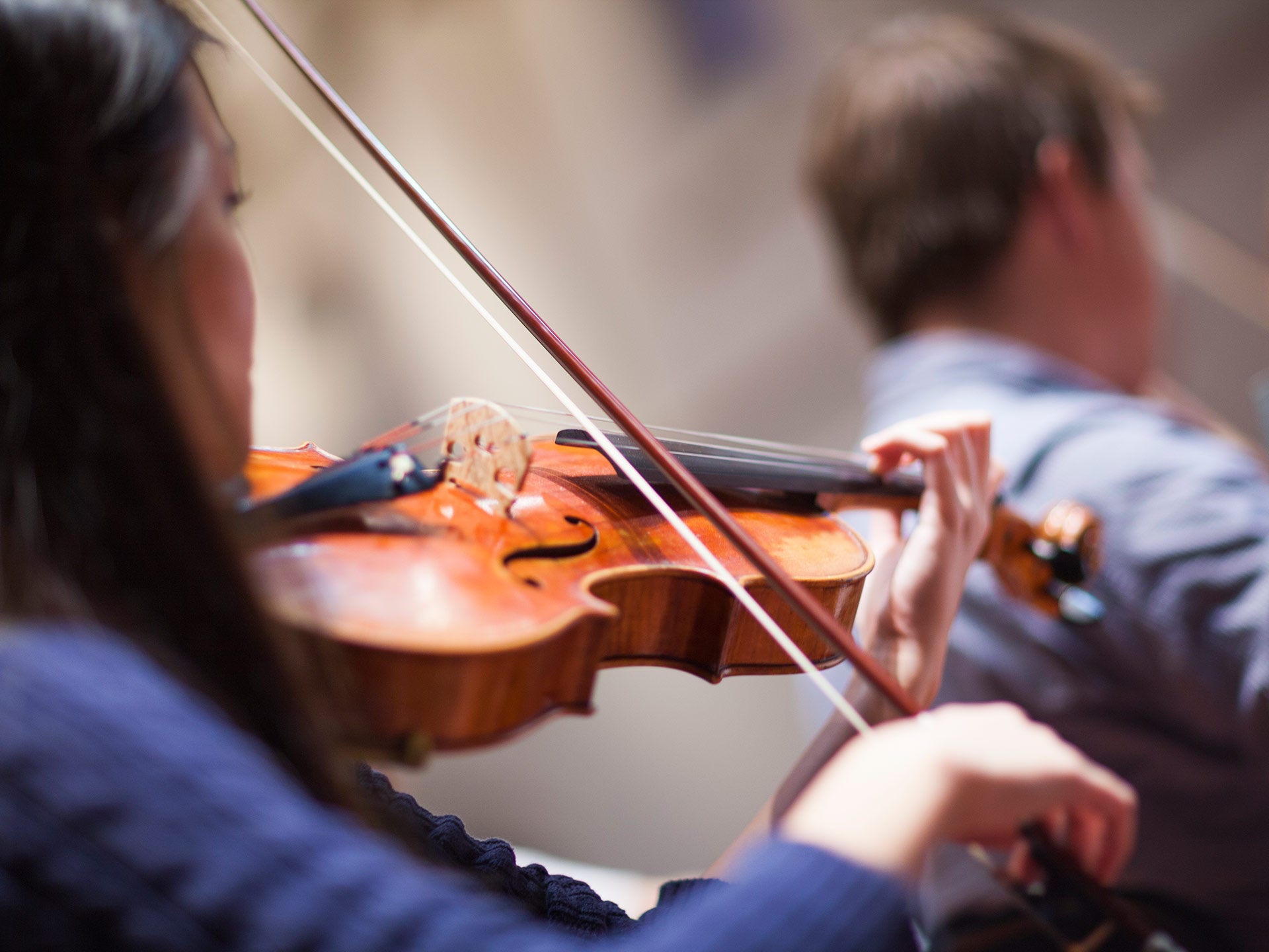 Violinists playing in Elder Hall