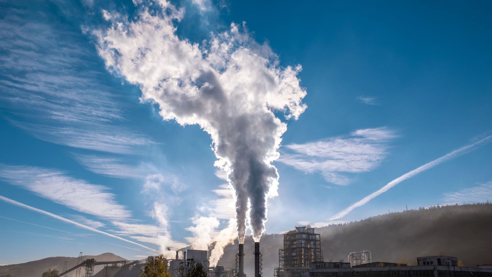 Factory emissions coming out of smoke stack