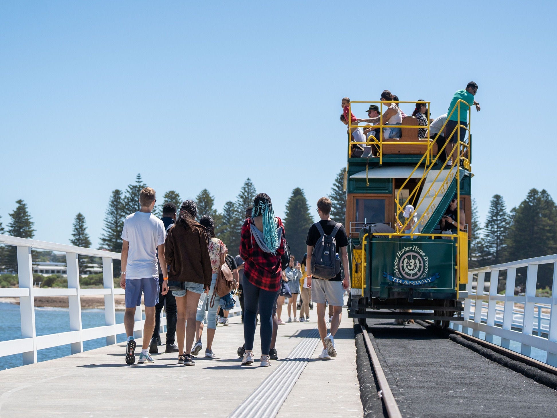 Students walking on the causeway to Granite Island