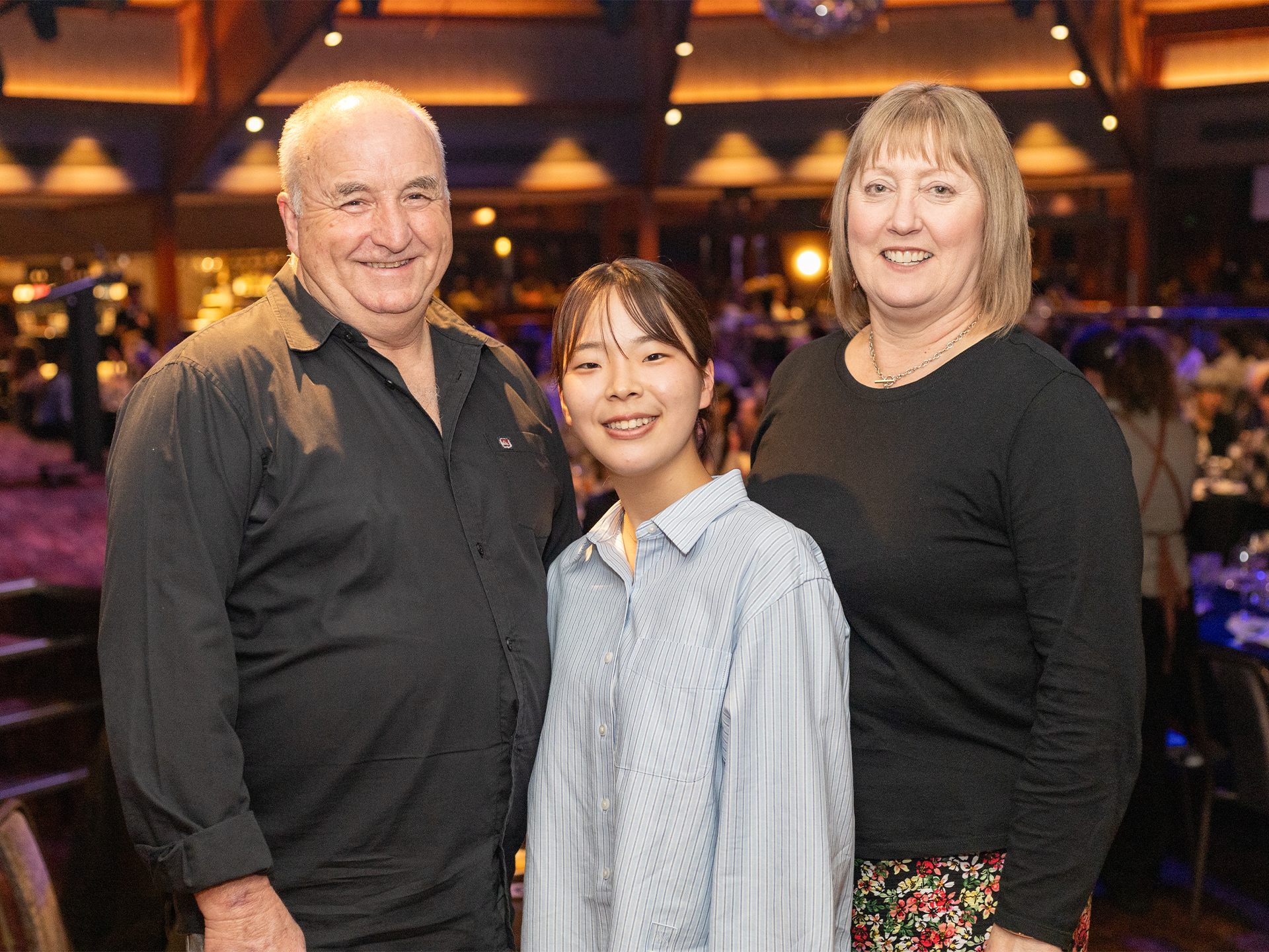 three people smiling