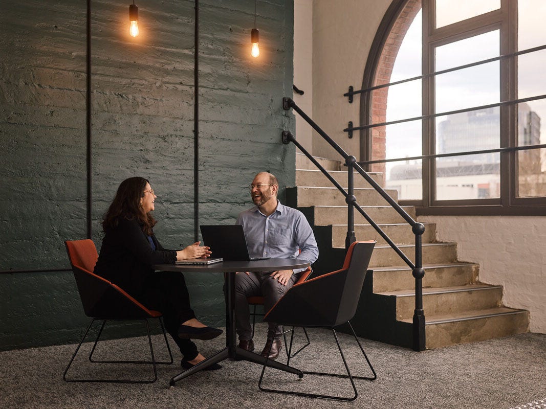 Professional staff sitting and chatting