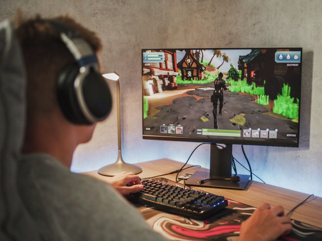 A teenager playing a video game