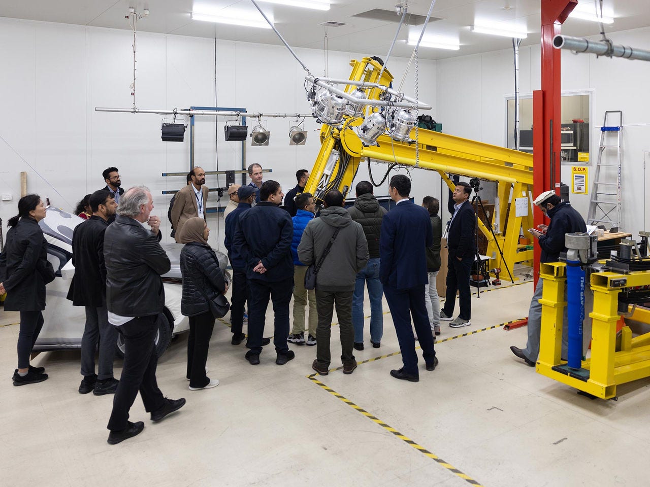 Participants inspecting equipment during the Road safety management training for South Asian countries
