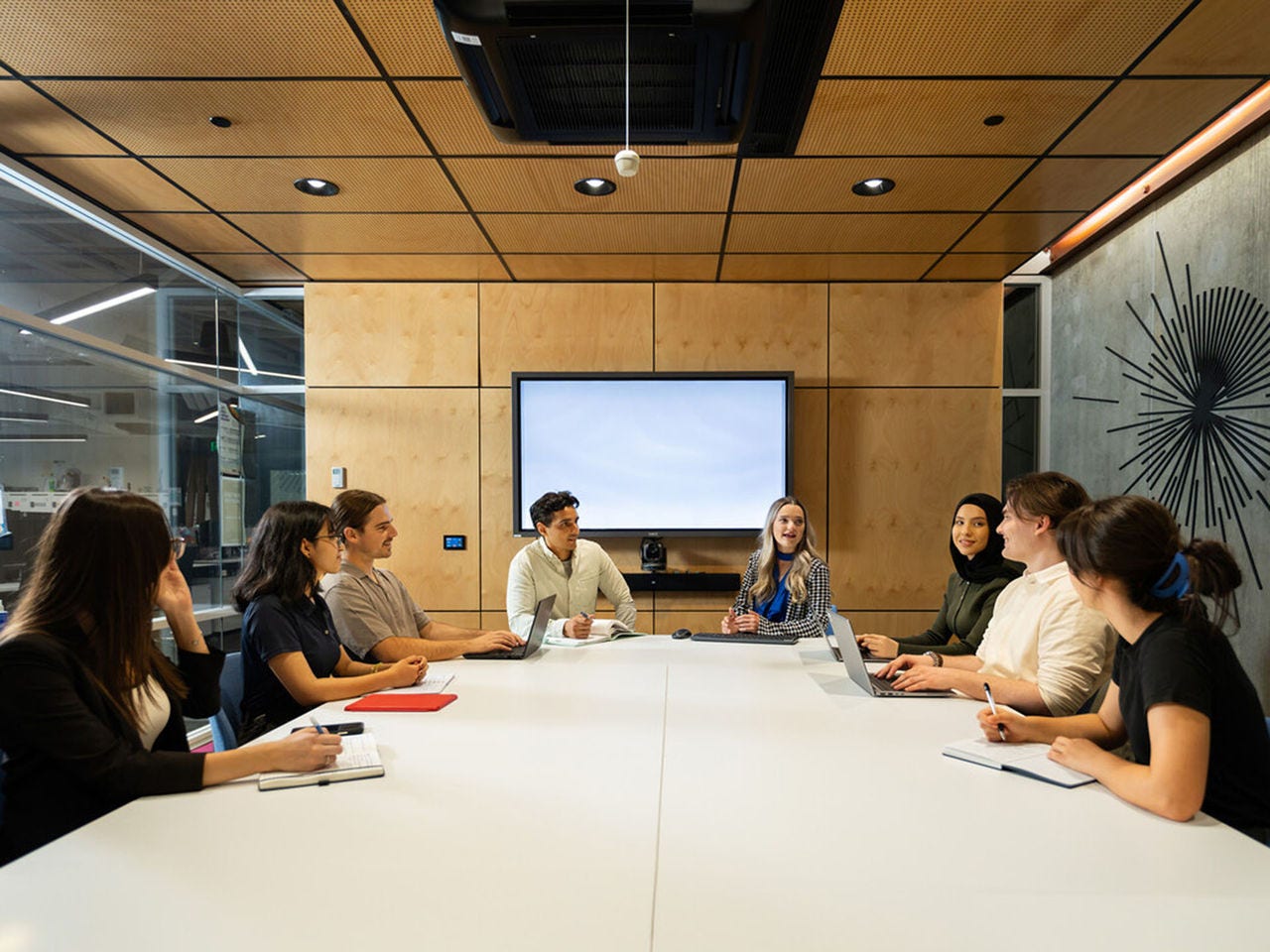 Postgraduate students in a meeting room