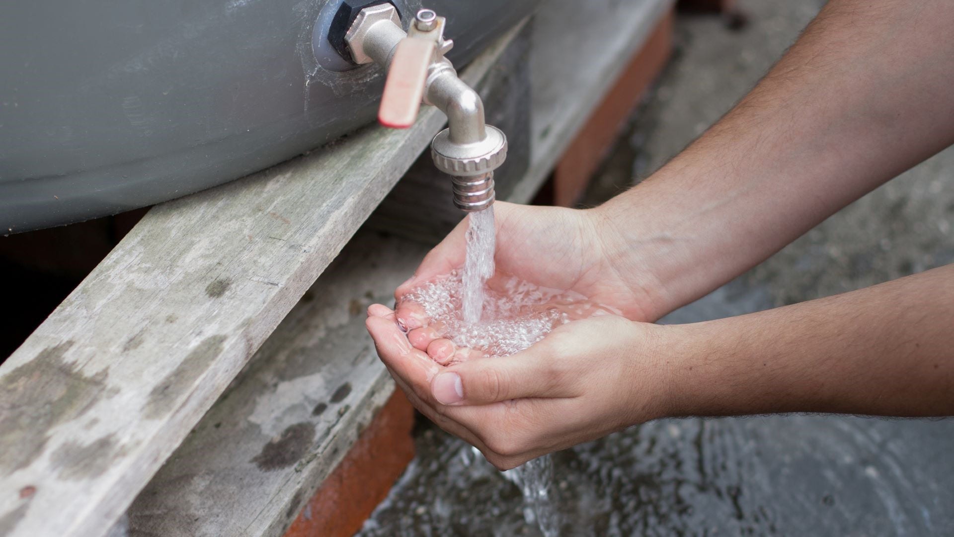 Person collecting rainwater