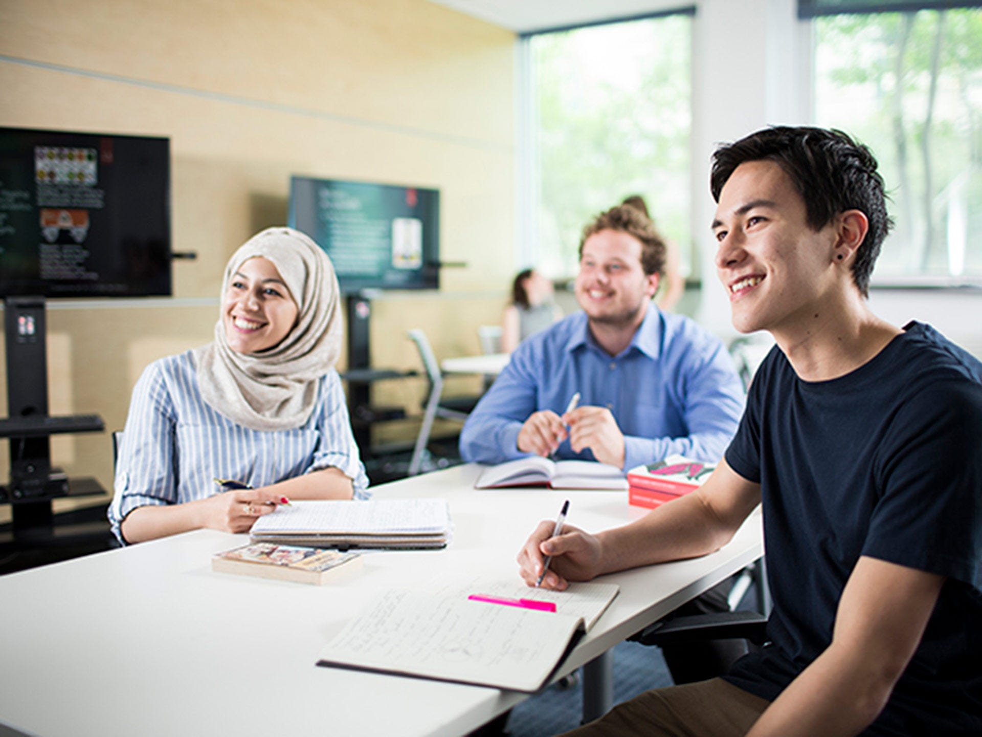 Students studying on campus in a group environment