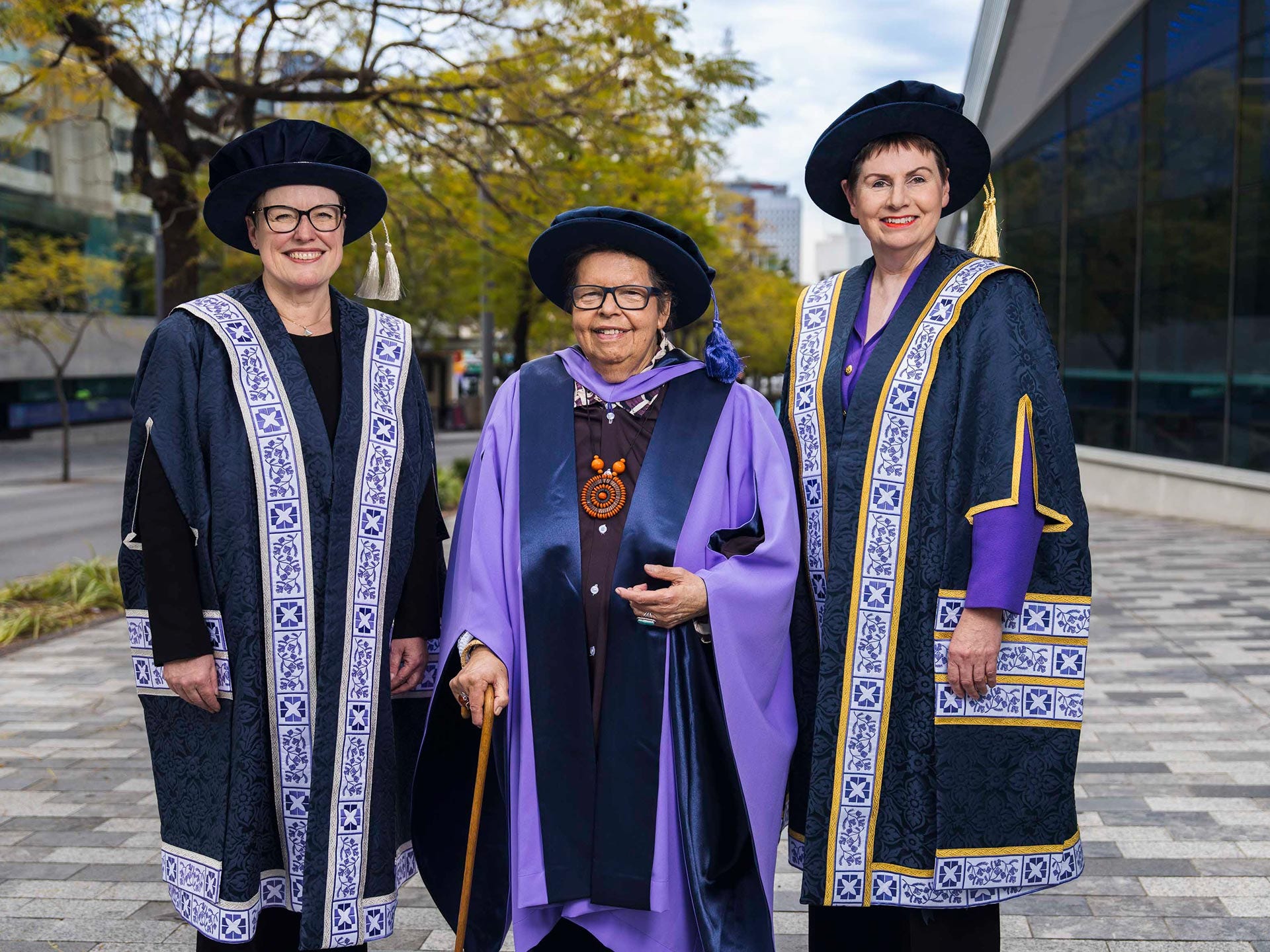Aunty Lynette Crocker (centre) with Adelaide University Vice Chancellor Professor Nicola Phillips and Chancellor Pauline Carr.