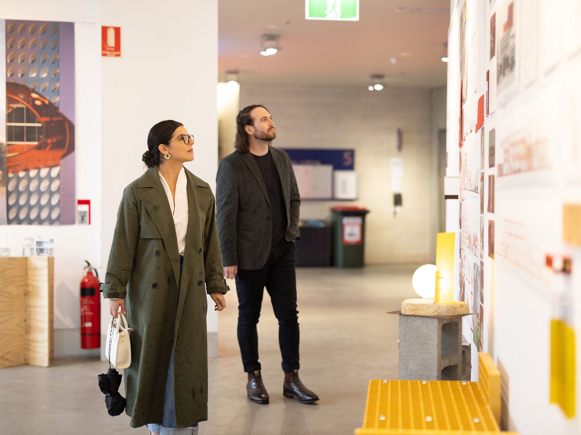 two people looking at drawings