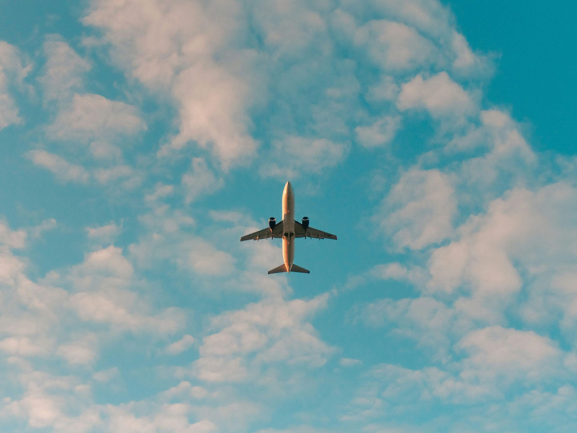 A plane flying amongst the clouds