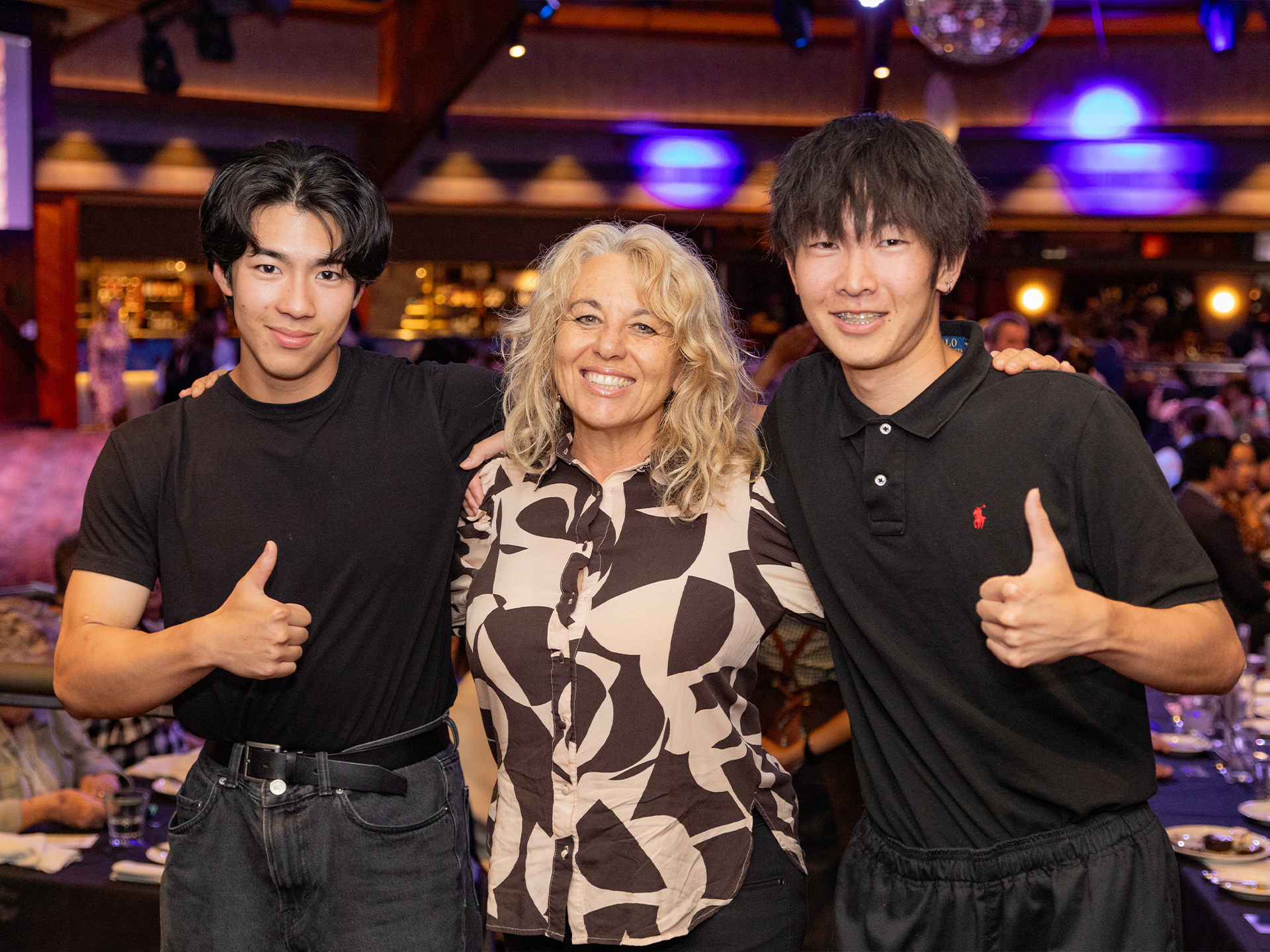 three people smiling