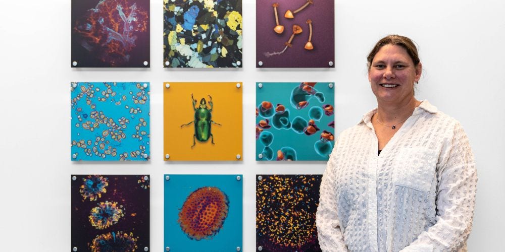 Adelaide Microscopy Deputy Director Dr Jane Sibbons with some of the images on display. 