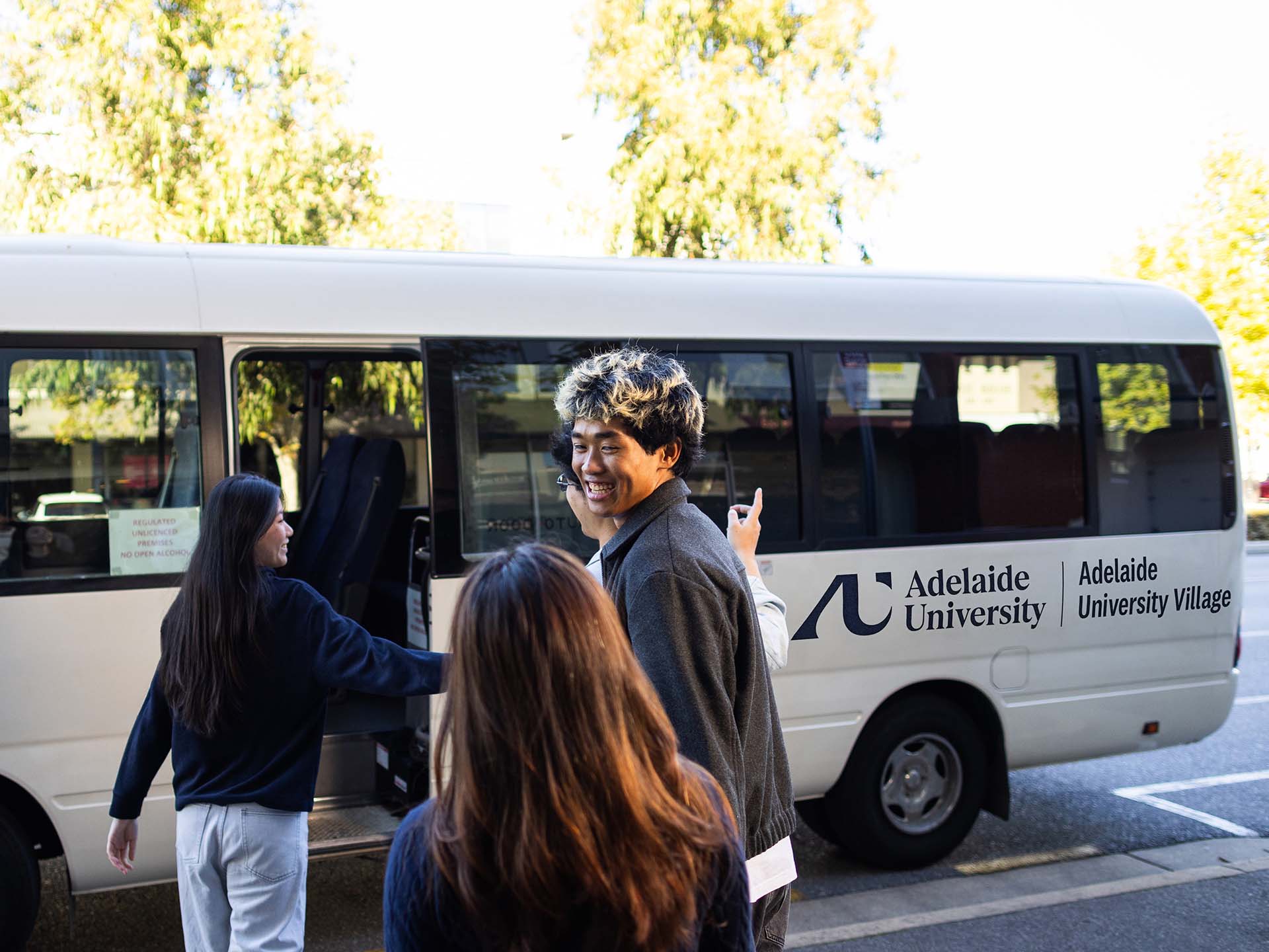 Residents using the shuttle bus at Adelaide University Village student accommodation