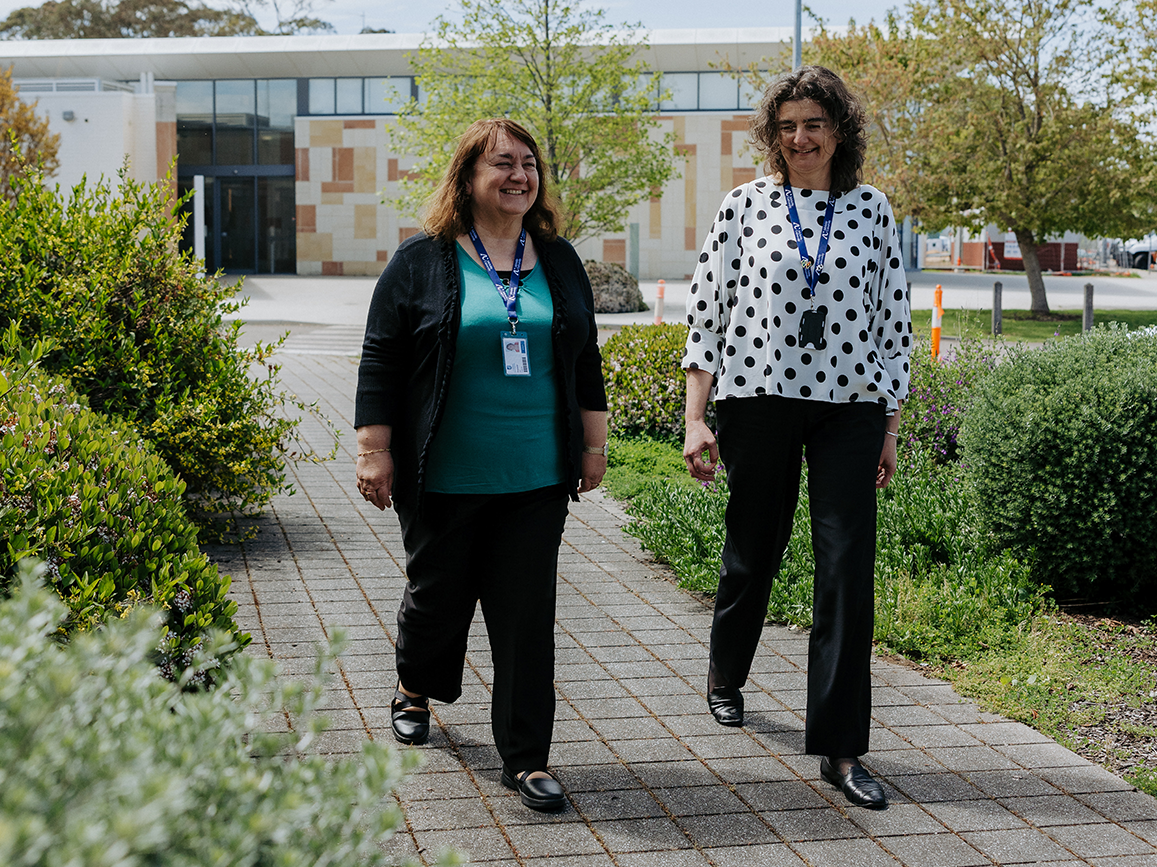 Peta Crewe and colleague taking a walk