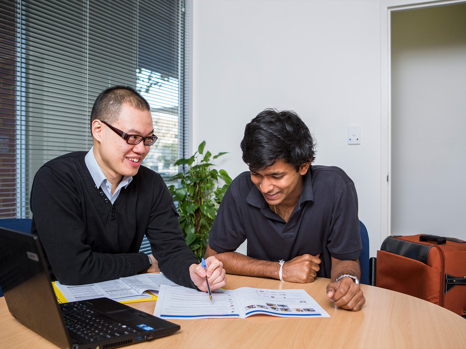Residents studying in the shared spaces at Adelaide University Village student accommodation