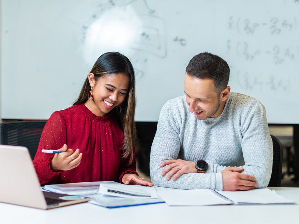 Research students sitting at a desk
