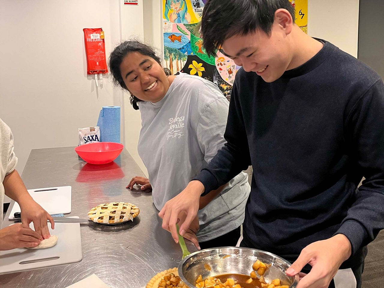 Accommodation students baking pies