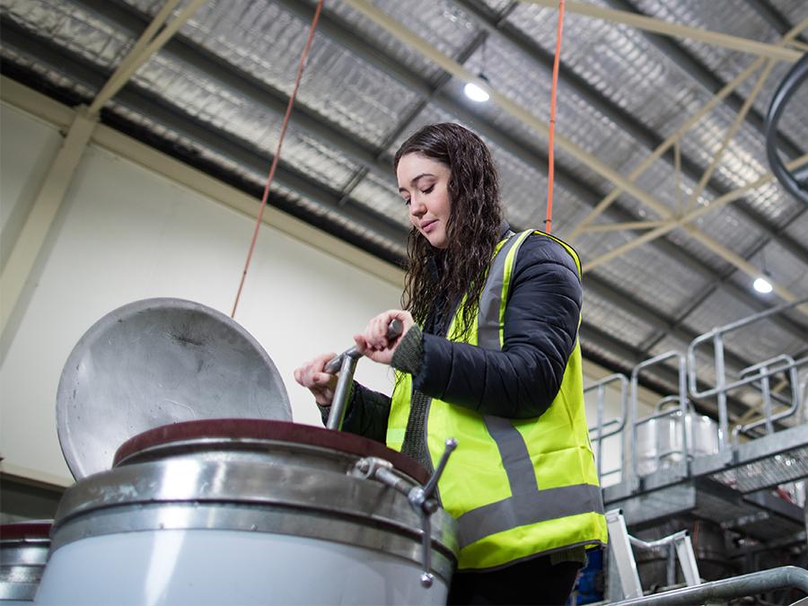 Wine studies graduate in a wine lab