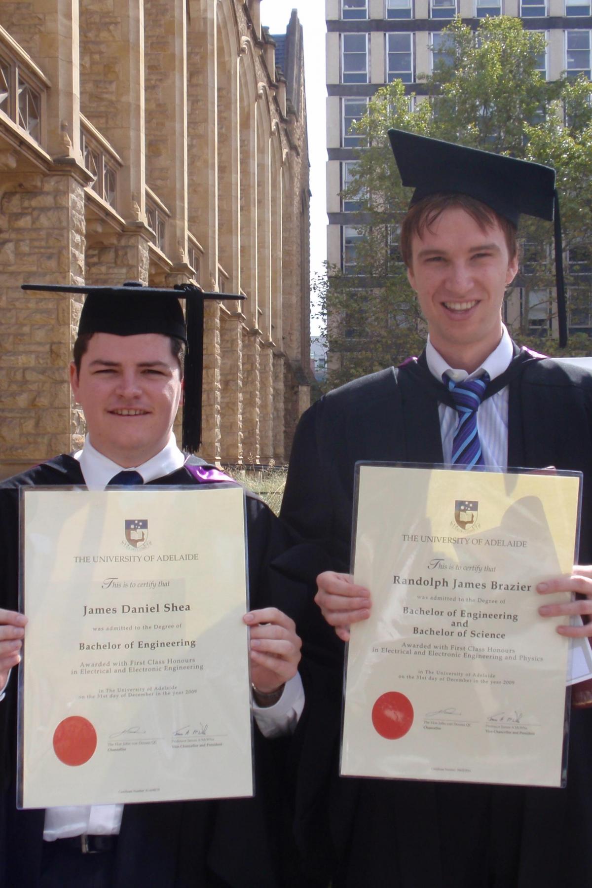 Randolf and his friend James outside Bonython Hall with their graduation testamurs