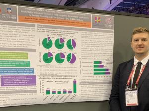 Bradley Pitman presenting poster at HRS 2019