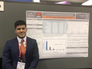 Ricardo Mishima presenting poster at HRS 2019