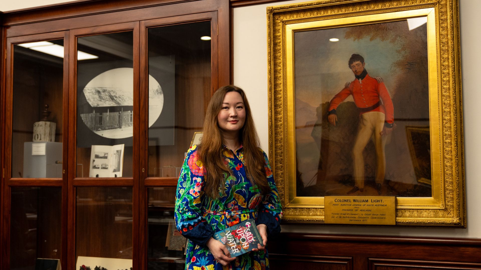Author Lyn Dickens with the self-portrait of Colonel Light