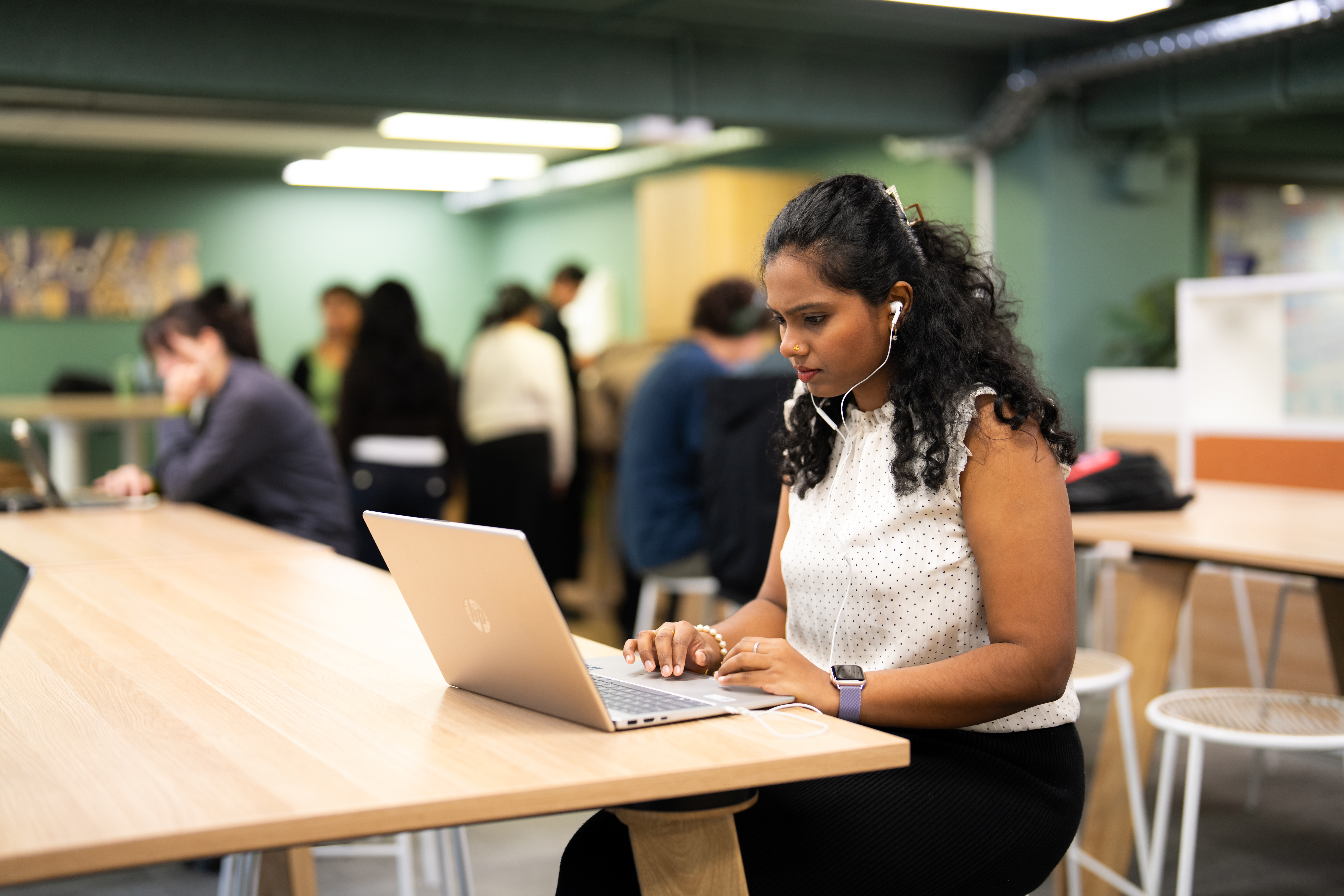 AU student sitting with a laptop